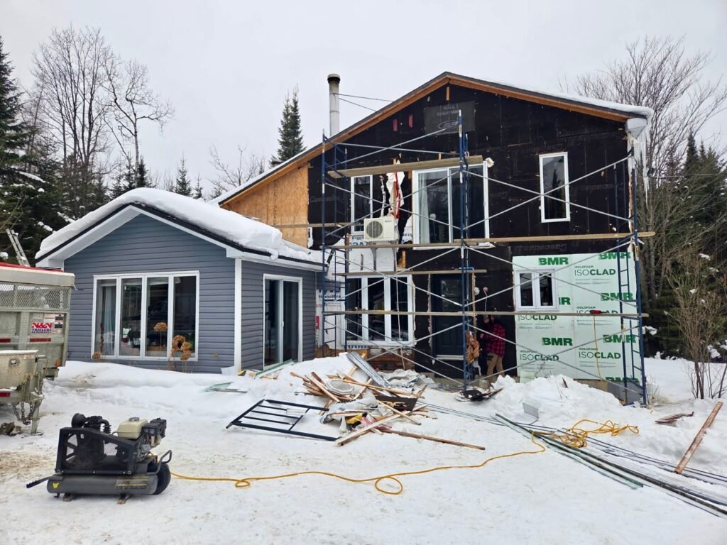 Farmhouse-style exterior renovation, stone and white vertical siding – MSC Construction